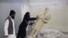A five-minute video from the Islamic State group purports to show militants destroying ancient artifacts in Iraq’s Mosul Museum. It was released Feb. 26, 2015.