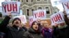 People hold placards reading "Shame to thieves with Boxes" during a demostration on Dec. 29, 2013 in Istanbul against corruption and the government.