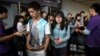 FILE - Students leave after a Scholastic Assessment Test session at AsiaWorld-Expo in Hong Kong Nov. 2, 2013.