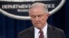 FILE - Attorney General Jeff Sessions pauses during a news conference at the Justice Department in Washington, March 2, 2017. 