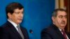 Turkish Foreign Minister Ahmet Davutoglu, left, speaks as his Iraqi counterpart Hoshyar Zebari, listens during a joint press conference in Baghdad, Iraq, Sunday, Nov. 10, 2013