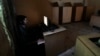 FILE - A man uses a computer at an internet cafe in Rawalpindi, Pakistan, Sept. 18, 2013. At least four secular activists and bloggers mysteriously went missing a week ago from different cities in Pakistan.
