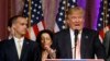 Republican presidential candidate Donald Trump speaks to supporters at his primary election night event at his Mar-a-Lago Club in Palm Beach, Fla., March 15, 2016. At left is his campaign manager Corey Lewandowski.