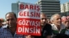 FILE-Thousands of Alevi Muslims, members of Turkey's largest religious minority group, with some holding banners that read "Let's make peace and stop bloodshed" rally in Ankara.