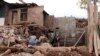 FILE - Pakistani villagers living at the Line of Control between Pakistan-Indian Kashmir, Chakoti, build concrete house in Pakistan, Nov. 21, 2016.