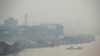 FILE - Haze from forest fires blankets villages along Kahayan river in Palangkaraya, Central Kalimantan, Indonesia, Sept. 20, 2019. Haze blown by monsoon winds from fires in Indonesia has begun affecting some areas of the Philippines.