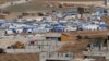 FILE - Tents house Syrian refugees in the city of Arsal in Lebanon's Bekaa valley, near the border with Syria.