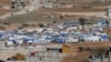 FILE - Tents house Syrian refugees in the city of Arsal in Lebanon's Bekaa valley, near the border with Syria.