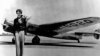 Amelia Earhart, 40, stands next to a Lockheed Electra 10E, before her last flight in 1937 from Oakland, Calif., bound for Honolulu.