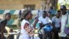 Katungo Methya, 53, who volunteers for the Red Cross educating the public about epidemics, talks about coronavirus prevention in Beni, eastern Congo, April 7, 2020.