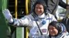 FILE - U.S. astronaut Jack Fischer, above, and Russian cosmonaut Fyodor Yurchikhin, crew members of the mission to the International Space Station, wave near the rocket prior launch at the Russian-leased Baikonur cosmodrome, Kazakhstan, April 20, 2017. 