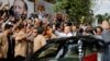 Turkish President Tayyip Erdogan waves to supporters as he leaves his residence in Istanbul, Turkey, June 24, 2018. 