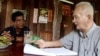 Thet Sambath, filmmaker of the 'Enemies of the People', talking to former Khmer Rouge leader Nuon Chea. 