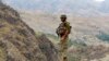FILE - A Pakistan army soldier stands guard in the Pakistani tribal area of Khyber near the Torkham border post between Pakistan and Afghanistan, June 15, 2016.
