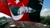 An anti-government protester waves a Turkish flag depicting the founder of modern Turkey Mustafa Kemal Ataturk as thousands of protesters gather in Istanbul's Taksim square, June 9, 2013.