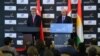Turkish Energy Minister Taner Yildiz (L) and his Iraqi Kurdish counterpart Ashti Hawrami hold a press conference in Arbil, the capital of the autonomous Kurdish region in northern Iraq, Dec. 2, 2013. 