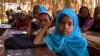 FILE - Young girls attend a math class in January 2014 at a school in Niger's Diffa region, where more than half of the students are Nigerians who have been displaced by fighting.