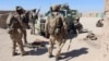 FILE - Afghan Special Forces prepare themselves for battle with the Taliban on the outskirts of Lashkar Gah capital of Helmand, Afghanistan, Oct. 10, 2016. 