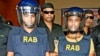 Abdul Hakim (L), 22, and Mahmudul Hasan, 17, members of homegrown banned militant outfit Jamaayetul Mujahideen Bangladesh (JMB) are presented to the media after they surrendered in Bogra on October 5, 2016.