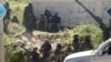 This image posted on the Twitter page of Syria's al-Qaida-linked Nusra Front, April 25, 2015, shows Nusra Front fighters in the town of Jisr al-Shughour, Idlib province, Syria.