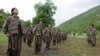 Kurdistan Workers Party (PKK) fighters stand in formation in northern Iraq May 14, 2013. 