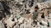 A boy walks on the rubble of buildings damaged by what activists said were missiles fired by Syrian Air Force fighter jets loyal to President Bashar al-Assad in Salqin city, Idlib governate, May 28, 2013.