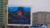 A military-themed movie is broadcast on a large TV screen near the train station in Pyongyang, North Korea, April 10, 2012.