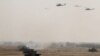 Pakistan's army tanks and helicopters, seen in this army-issued photo, take part in a military exercise in Khairpur Tamiwali, Pakistan, Wednesday, Nov. 16, 2016.