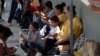 Central American migrants wait to enter Mexico legally, outside a Mexican immigration control center on Mexico's southern border with Guatemala, near Ciudad Hidalgo, Mexico, June 6, 2019.