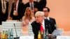 U.S. President Donald Trump sits in front of his delegation with daughter Ivanka Trump, background center, as he attends a working session at the G-20 summit in Hamburg, northern Germany, July 8, 2017.