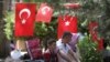 People rest in Kugulu Park in Ankara, Turkey, June 24, 2013. 