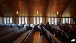 Roughly a dozen people attend pastor Ryan Burge's Sunday service at First Baptist Church in Mt. Vernon, Ill., Sept. 10, 2023. Burge is the author of "The Nones," a book on the growing number of religiously unaffiliated Americans. 