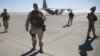 Out going U.S. Marine Brigadier Gen. Roger B. Turner walks on the airfield after the change of command ceremony in Shorab military camp of Helmand province, Afghanistan, Jan. 15, 2018. 