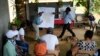 Panama Canal representatives explain to locals how a proposed dam project in the Indio River that aims to secure the canal's uninterrupted operation could affect the future of El Jobo, Aug. 31, 2024.
