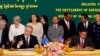 Australian Immigration Minister Scott Morrison, front left, signs a document together with Cambodian Interior Minister Sar Kheng, front right, during a signing ceremony of a controversial deal on resettlement of refugees inside the Interior Ministry in Ph