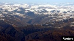 FILE - The Himalayan range is seen in this aerial view taken from an aircraft flying over Nepal. In background is the Tibetan Plateau. 