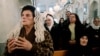 Syrian Christians and Muslims offer prayers for nuns held by rebels, at the Greek Orthodox Mariamiya Church in Damascus, Syria, Sunday, Dec. 8, 2013.