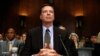 FILE - FBI Director James Comey prepares to testify on Capitol Hill in Washington, May 3, 2017, before the Senate Judiciary Committee. 