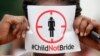 FILE - A woman protests against underage marriages in Lagos, Nigeria, July 20, 2013. The African Union is to convene a summit in Zambia this week with a view to ending child marriage. 