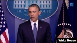 President Barack Obama talks to reporters at the White House, Aug. 1, 2014. 