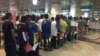 FILE - Myanmar migrants in Malaysia return home in this July 2016 photo provided by the Myanmar Embassy in Kuala Lumpur.
