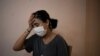 Rachelle Boumelhem reacts during an interview in her damaged beauty salon in Beirut, Lebanon, Aug. 10, 2020.