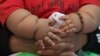 FILE - The World Health Organization is developing recommendations to curb excessive weight in children. 