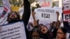 FILE - Activists of various left organizations shout slogans during a protest against hate speech in New Delhi, India, Dec.27 2021.