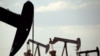 FILE - Pumpjacks are seen in a field near Lovington, New Mexico, April 24, 2015. The U.S. Environmental Protection Agency is expected to roll back requirements on detecting and plugging methane leaks at oil and gas facilities.