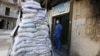 A medic stands behind sandbags in the damaged al-Hakeem hospital, in the rebel-held besieged area of Aleppo, Syria, Nov. 19, 2016. Top U.N. officials warned Monday, Nov. 21, 2016, that health care services in Syria have been devastated by bombings.