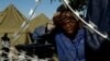 A man washes his face outside a shelter for displaced foreigners in east of Johannesburg, South Africa, April 21, 2015. 