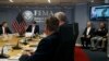 President Trump, left, listens as Kenneth Graham, director of NOAA's National Hurricane Center, on screen, gives an update during a briefing about Hurricane Dorian at the Federal Emergency Management Agency (FEMA), Sunday, Sept. 1, 2019.