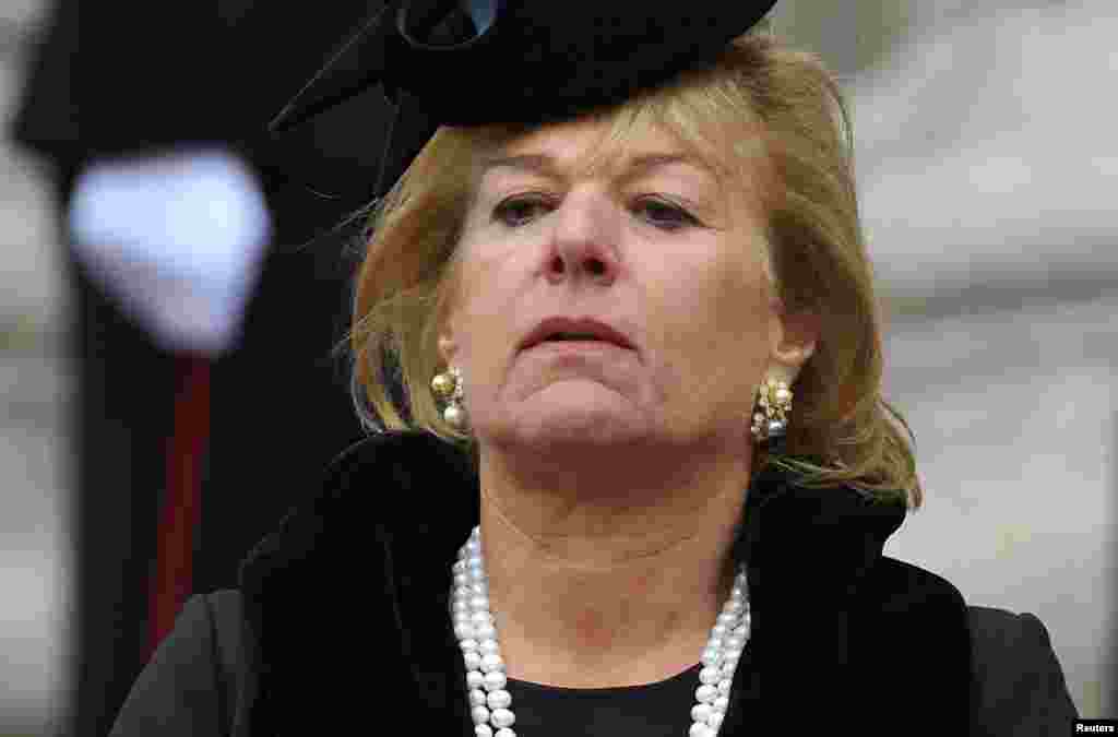 Carol Thatcher watches as the hearse carrying her mother, former British prime minister, Margaret Thatcher, is driven away after her funeral service at St Paul's Cathedral.