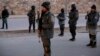 Afghan security forces inspect the site of two large bombings in Kabul, Afghanistan, Jan. 10, 2017. 